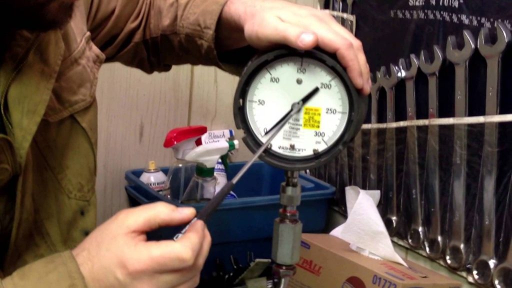 Calibration using dead weight tester pressure gauge calibration standard